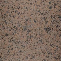 Close-up of a textured granite surface with beige, brown, and pink speckles.